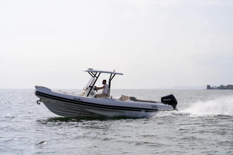 Slide: The Image of Aqvaboats Luxrib 25 (2026) cruising on open water, showcasing sleek design and performance. - 30