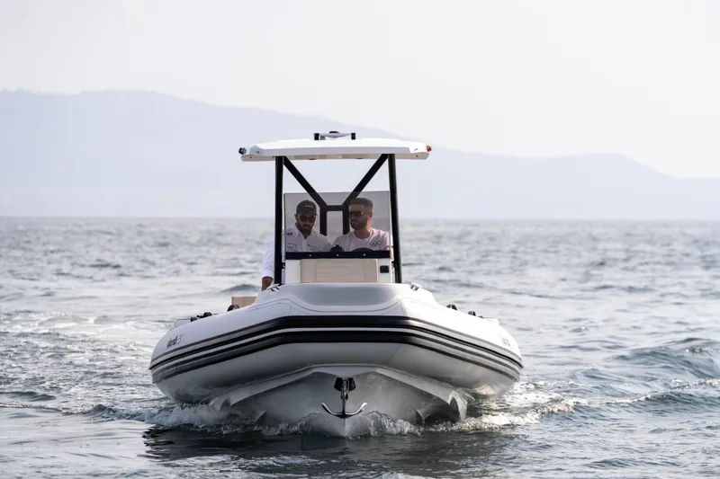 Slide: The Image of 2026 Aqvaboats Luxrib 25 cruising on open water with two passengers onboard. - 35