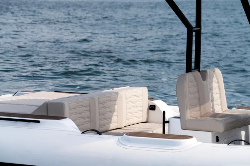 Slide: The Image of Luxury seating on 2026 Aqvaboats Luxrib 25, cruising on serene waters. - 38
