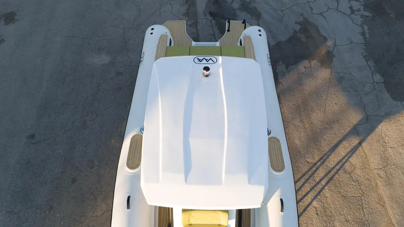 Slide: The Image of Aerial view of 2025 Aqvaboats Luxrib 25, showcasing sleek design and deck details. - 4