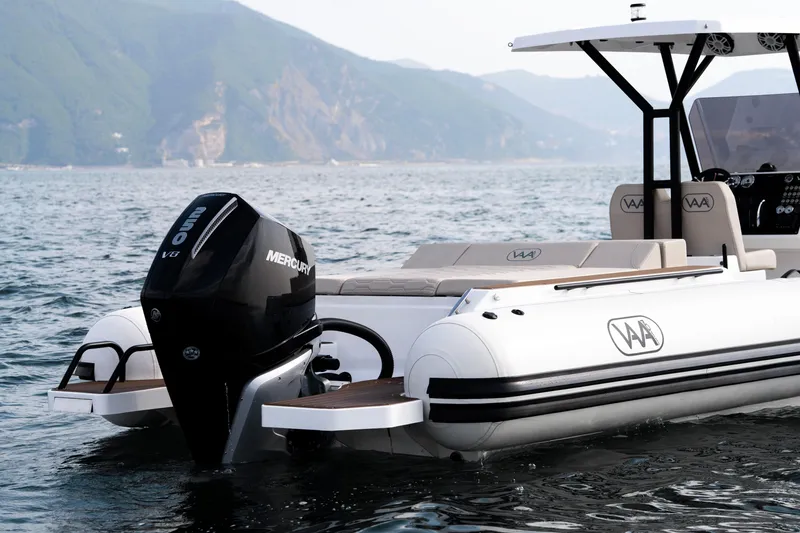 Slide: The Image of Aqvaboats Luxrib 25, 2026 model, with Mercury engine on scenic water backdrop. - 41