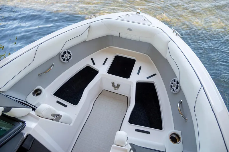 Slide: The Image of Manufacturer Provided Image: 2026 Regal LS2 boat interior with cushioned seating and storage compartments. - 6