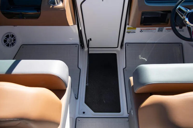 Slide: The Image of Manufacturer Provided Image: Interior of 2026 Regal LS2 boat with tan and gray seating. - 8