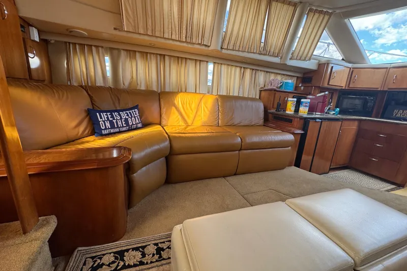 Slide: The Image of Luxurious interior of 2003 Carver 444 Cockpit Motor Yacht with leather seating and kitchenette. - 19