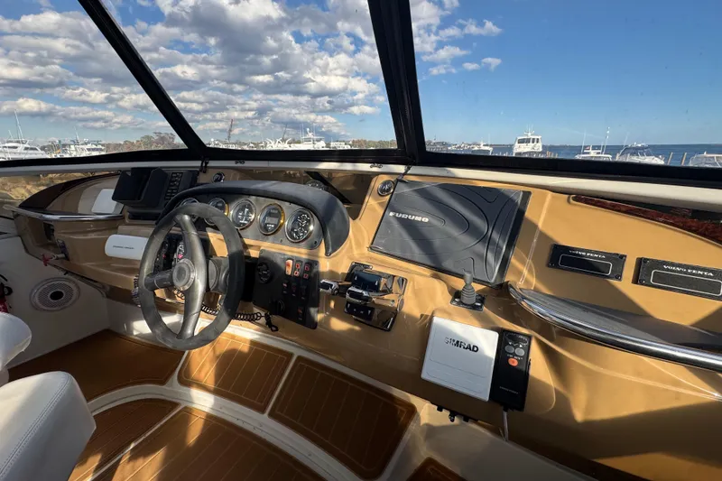 Slide: The Image of Interior cockpit view of 2003 Carver 444 Cockpit Motor Yacht with navigation equipment. - 14