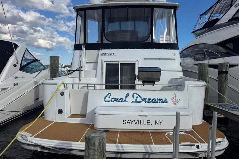 Slide: The Image of 2003 Carver 444 Cockpit Motor Yacht docked, named "Coral Dreams," in Sayville, NY. - 2