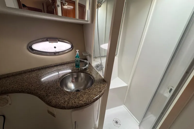 Slide: The Image of Bathroom interior of 2003 Carver 444 Cockpit Motor Yacht with sink and shower. - 35