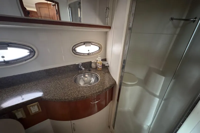 Slide: The Image of Bathroom interior of 2003 Carver 444 Cockpit Motor Yacht with granite countertop and shower. - 38