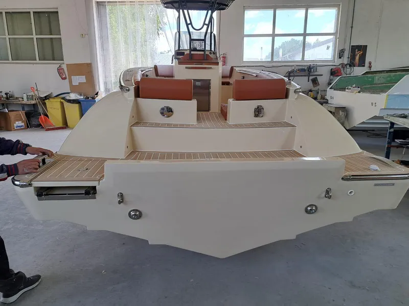 Slide: The Image of 2025 Lilybaeum Levanzo 25 Lounge Deck boat in a workshop setting. - 28