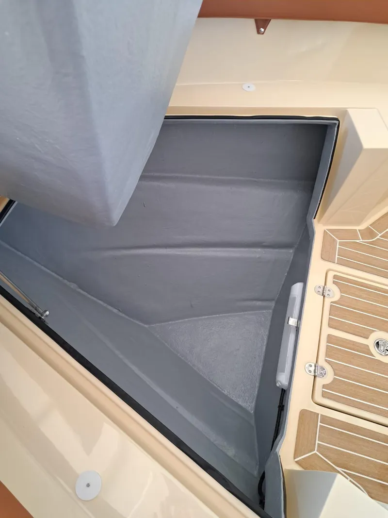 Slide: The Image of Storage compartment on Lilybaeum Levanzo 25 Lounge Deck, 2025 model, with wooden deck detail. - 40