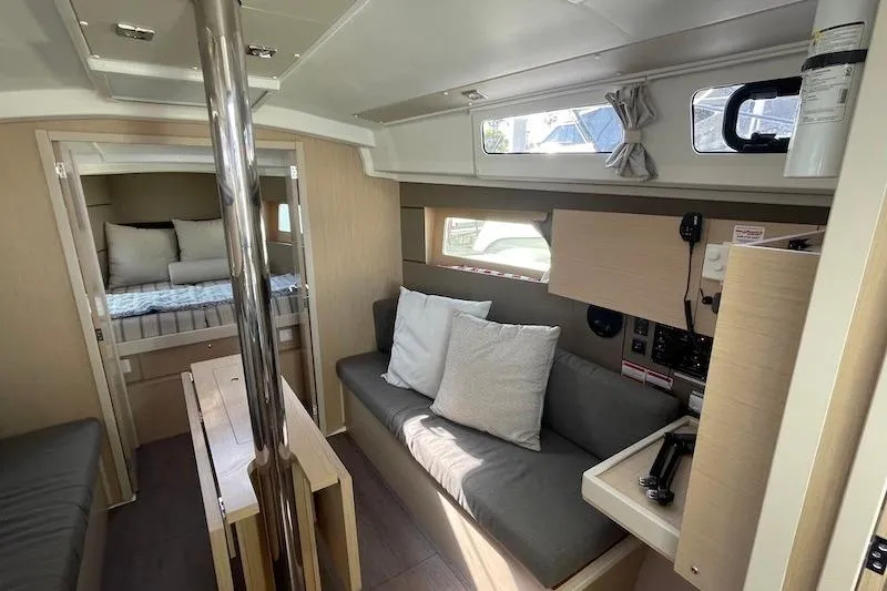 Slide: The Image of Interior of 2022 Beneteau Oceanis 35.1 yacht, featuring cozy seating and modern design. - 7