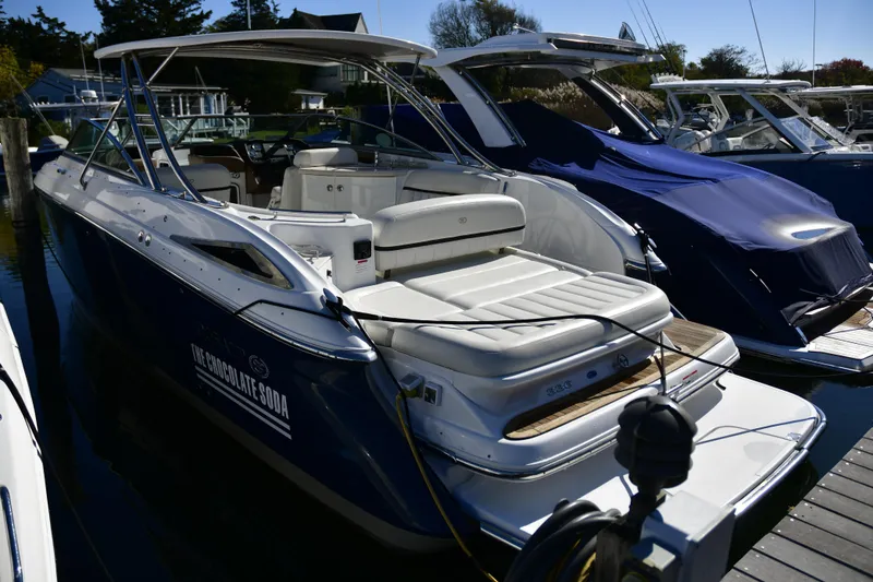 The Image of 2016 Cobalt 336 boat docked, featuring sleek design and spacious seating. - 0