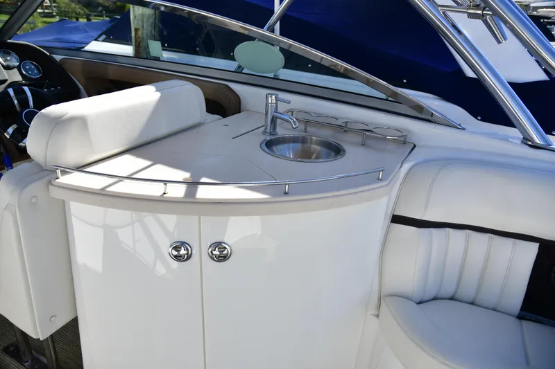 Slide: The Image of 2016 Cobalt 336 boat interior with sink and seating area. - 3