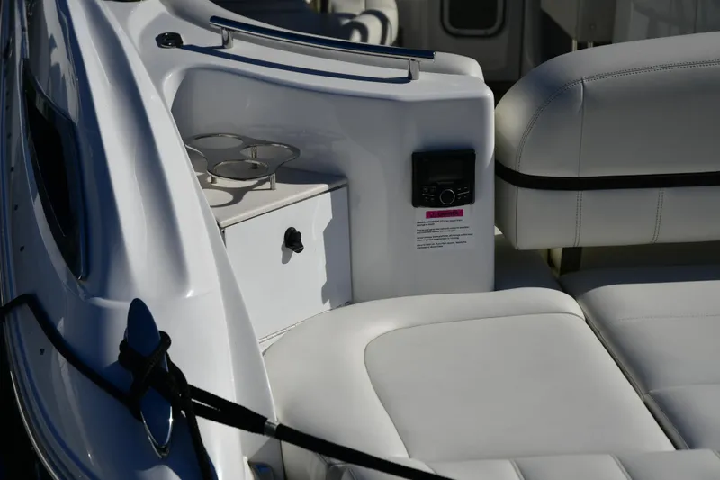 Slide: The Image of 2016 Cobalt 336 boat interior with white seating and cup holders. - 5