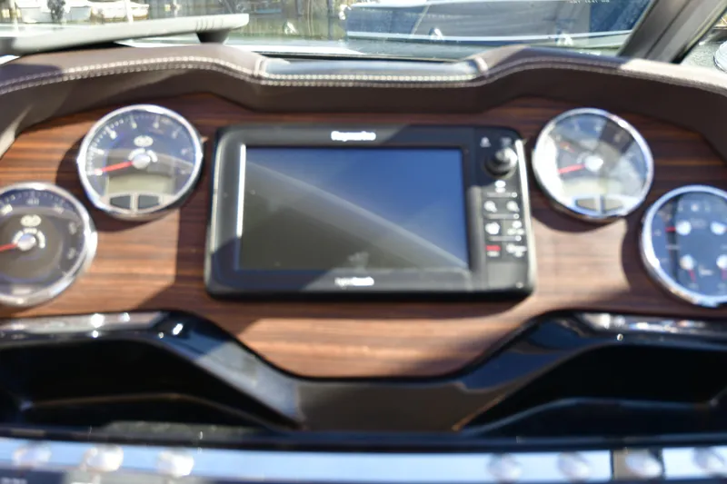 Slide: The Image of Dashboard of a 2016 Cobalt 336 boat with gauges and a central display. - 7