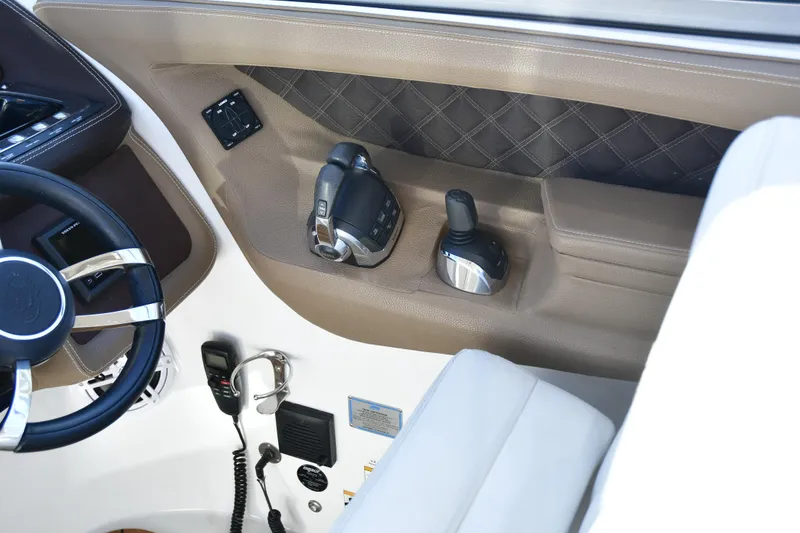 Slide: The Image of Interior of 2016 Cobalt 336 boat showing steering wheel and control panel. - 9