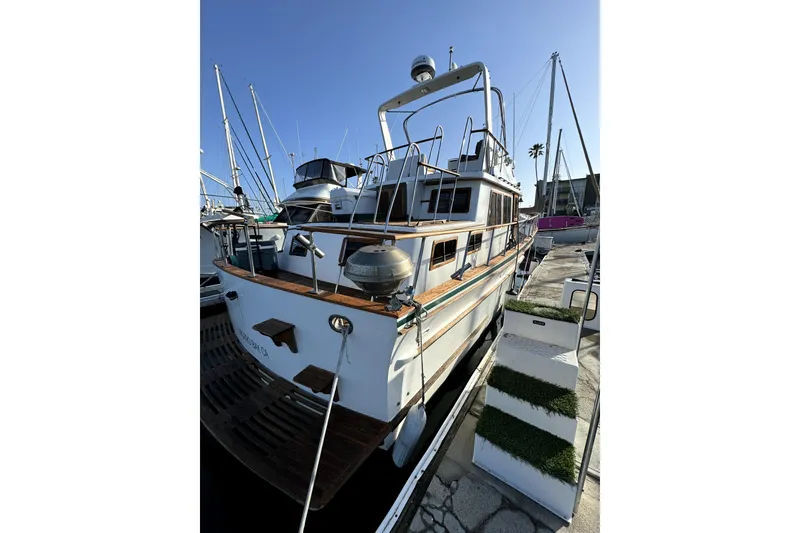 Slide: The Image of 1985 PT Boats PT 38 Aft Cabin docked at marina, sunny day. - 4