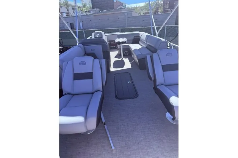 Slide: The Image of 2026 Sun Tracker Sportfish 24 XP3 pontoon boat interior with spacious seating and modern design. - 5