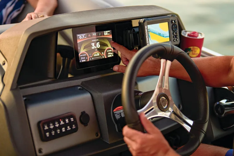 Slide: The Image of 2026 Sun Tracker Sportfish 24 XP3 interior with seating and fishing station. - 13