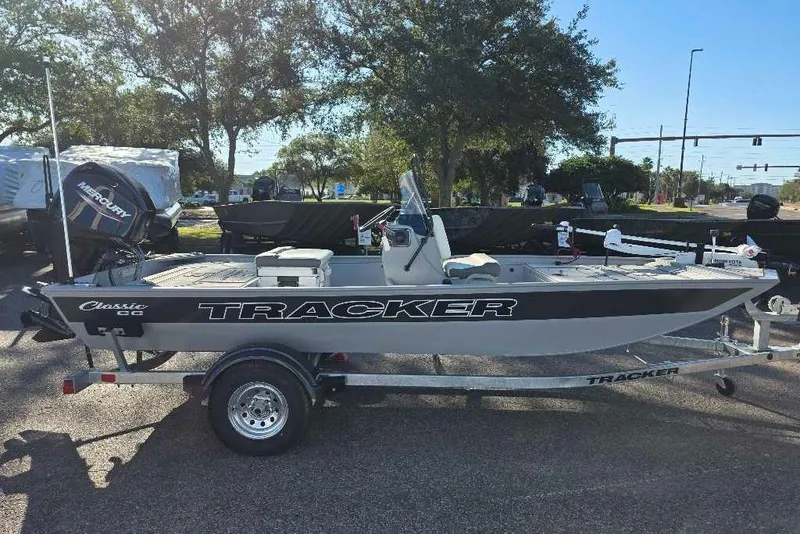Slide: The Image of 2026 Tracker Bass Tracker Classic CC boat on trailer, parked outdoors. - 4
