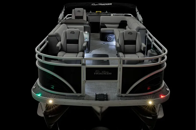 Slide: The Image of 2026 Sun Tracker Sportfish 24 XP3 boat deck with metal fixture and wiring visible. - 30