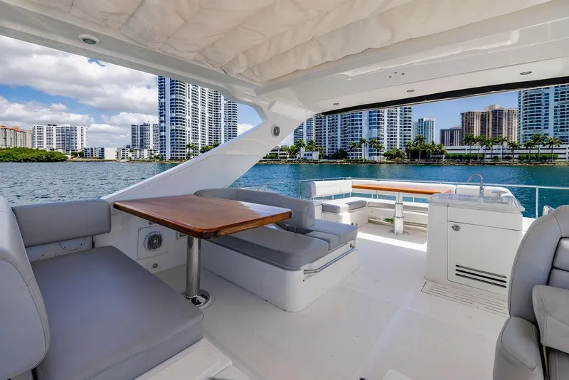 Slide: The Image of Luxurious 2016 Sea Ray L650 Fly yacht interior with city skyline view. - 11