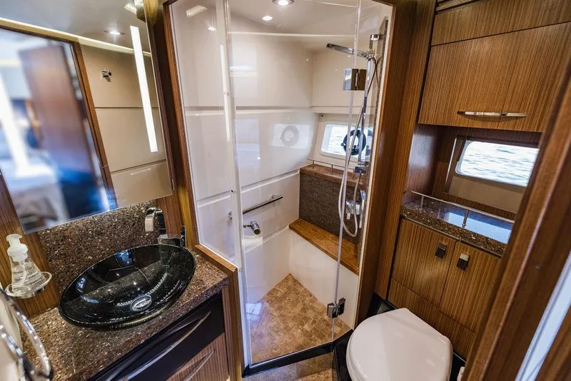 Slide: The Image of Luxurious bathroom in 2016 Sea Ray L650 Fly yacht with modern fixtures and elegant design. - 19