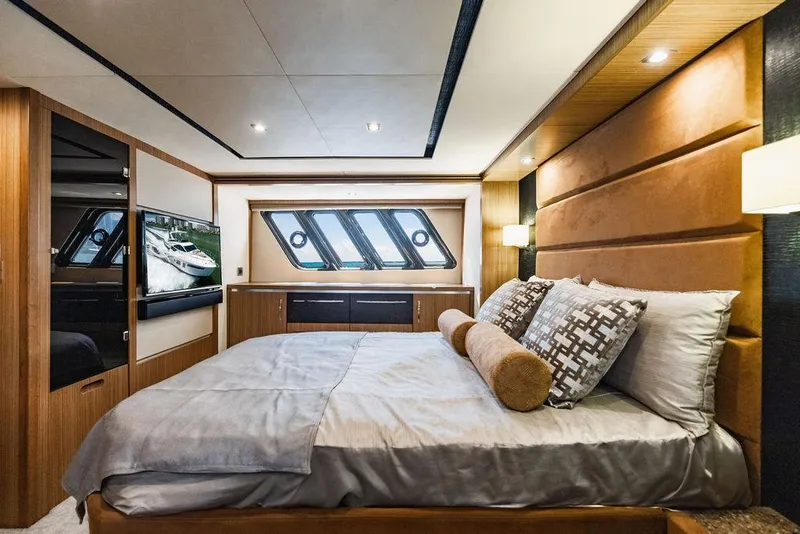 Slide: The Image of Luxurious bedroom interior of 2016 Sea Ray L650 Fly yacht with modern design and elegant furnishings. - 23