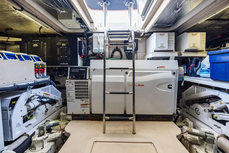 Slide: The Image of Engine room of 2016 Sea Ray L650 Fly yacht, featuring Cummins Onan generator and advanced equipment. - 25