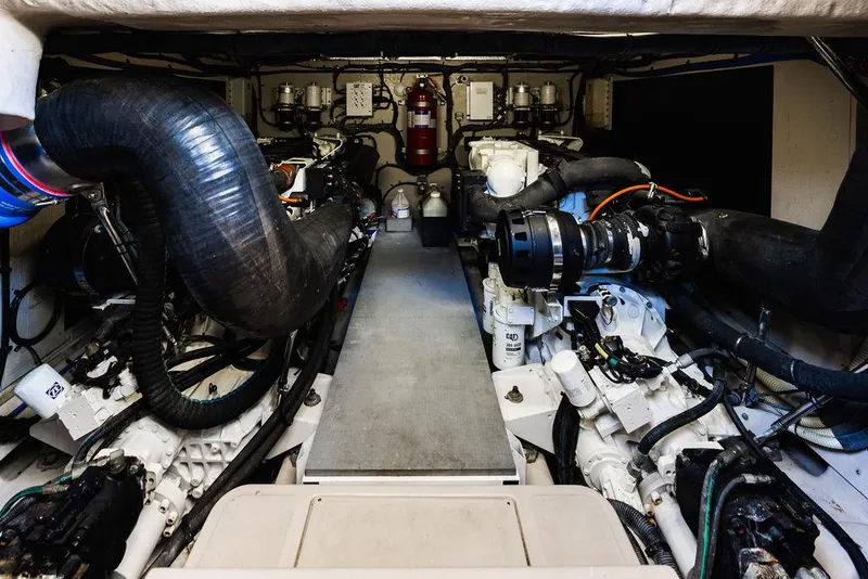 Slide: The Image of Engine room of 2016 Sea Ray L650 Fly yacht, showcasing mechanical components and systems. - 26