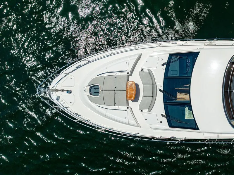 Slide: The Image of Overhead view of 2016 Sea Ray L650 Fly yacht on shimmering water. - 31