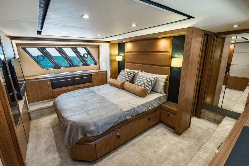 Slide: The Image of Luxurious bedroom interior of 2016 Sea Ray L650 Fly yacht with modern design and elegant furnishings. - 4