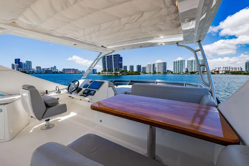 Slide: The Image of 2016 Sea Ray L650 Fly yacht interior with city skyline view. - 51