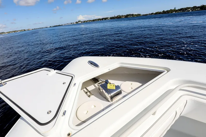 Slide: The Image of 2023 Contender 44 ST boat with open anchor hatch on calm water. - 13