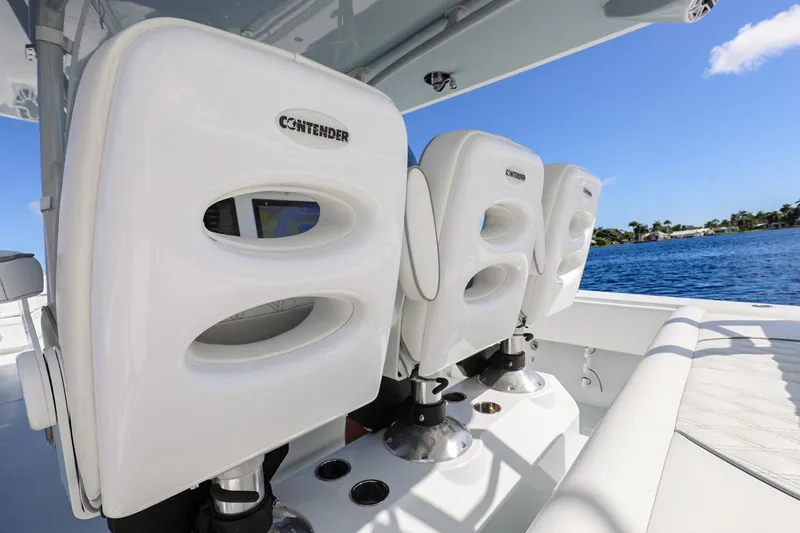 Slide: The Image of 2023 Contender 44 ST boat seats with ocean view and clear blue sky. - 20