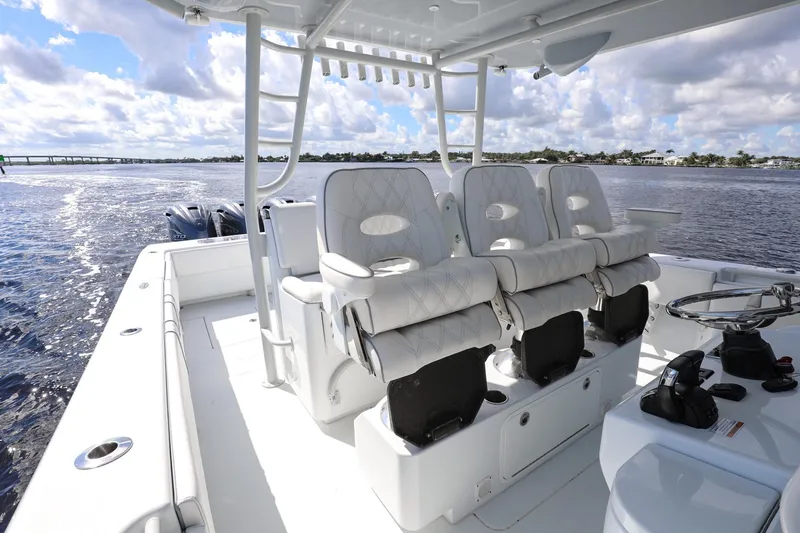 Slide: The Image of 2023 Contender 44 ST boat interior with luxurious seating and ocean view. - 22
