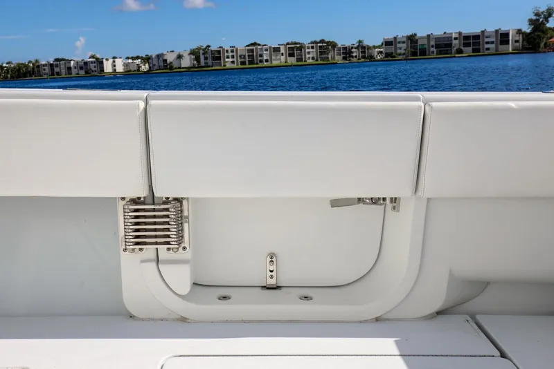 Slide: The Image of 2023 Contender 44 ST boat interior with white seating and lake view. - 26