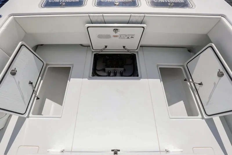 Slide: The Image of 2023 Contender 44 ST boat deck with open storage compartments. - 27