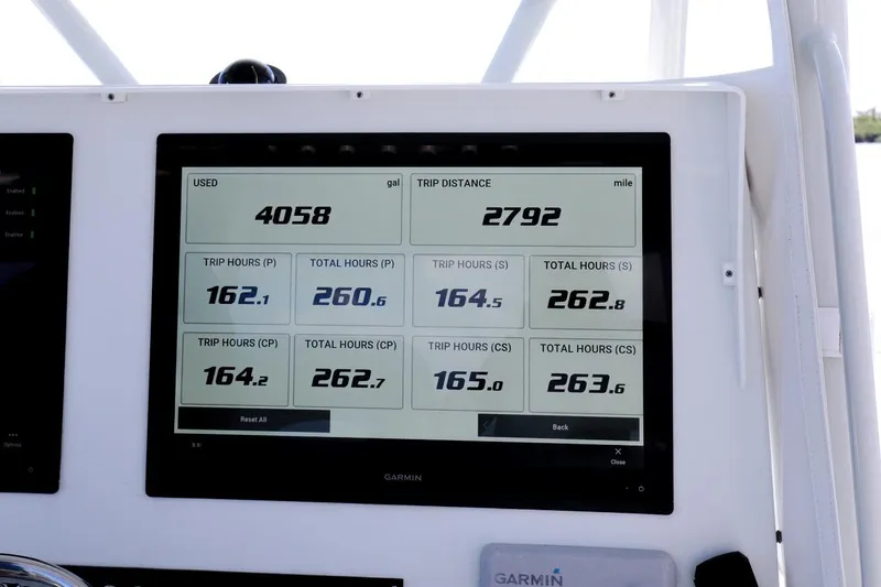 Slide: The Image of Dashboard display of 2023 Contender 44 ST showing fuel usage and trip data. - 31