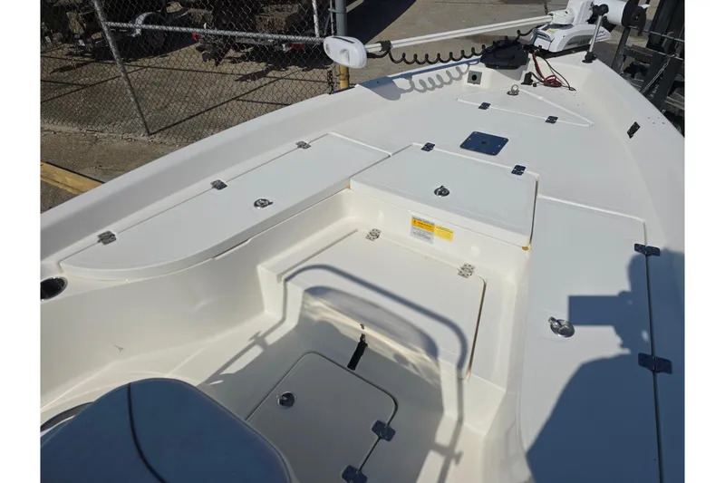 Slide: The Image of 2014 NauticStar 214 XTS Shallow Bay boat deck with storage compartments. - 14