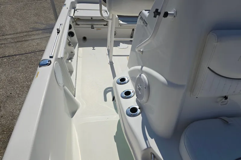 Slide: The Image of 2014 NauticStar 214 XTS Shallow Bay boat interior with seating and rod holders. - 18