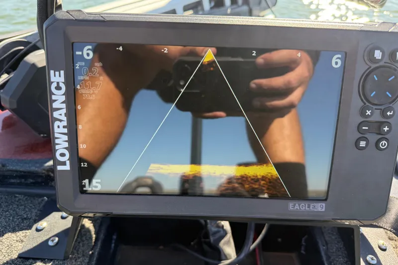 Slide: The Image of Lowrance fish finder on 2019 Nitro Z21 Pro boat, displaying sonar data on water. - 102