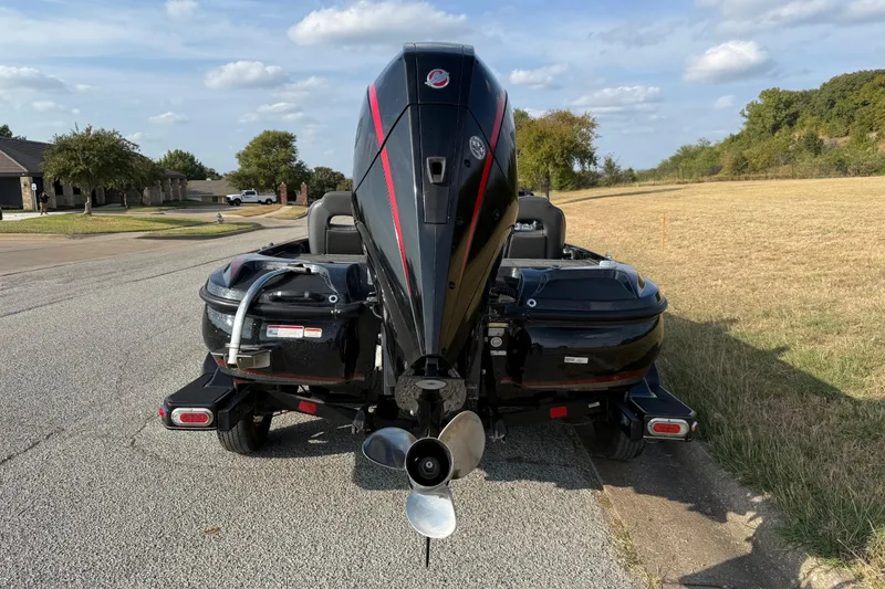 Slide: The Image of 2019 Nitro Z21 Pro bass boat on trailer, parked outdoors under blue sky. - 11