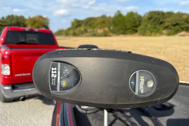 Slide: The Image of 2019 Nitro Z21 Pro boat on trailer, parked on roadside under clear sky. - 23