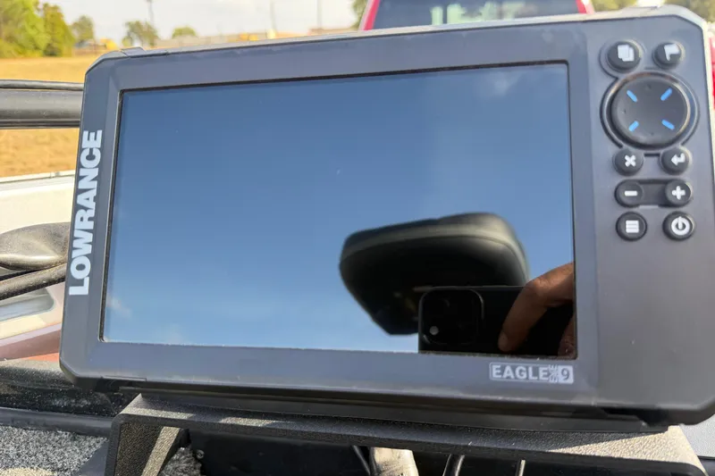 Slide: The Image of 2019 Nitro Z21 Pro boat with Minn Kota Ultrex trolling motor in a grassy area. - 24