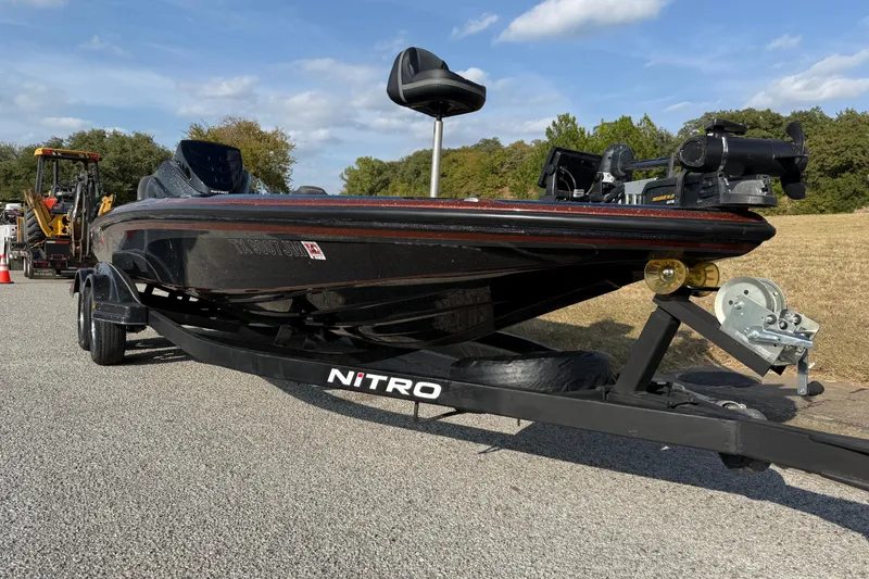 Slide: The Image of 2019 Nitro Z21 Pro boat with i-Pilot trolling motor, parked near a red truck. - 26