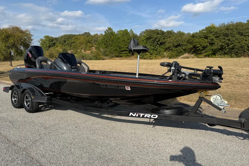 Slide: The Image of 2019 Nitro Z21 Pro boat dashboard with fishfinder and trolling motor controls. - 28