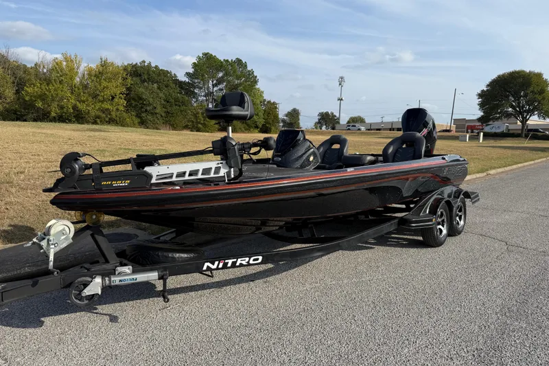 Slide: The Image of 2019 Nitro Z21 Pro boat on trailer, parked on suburban street. - 3