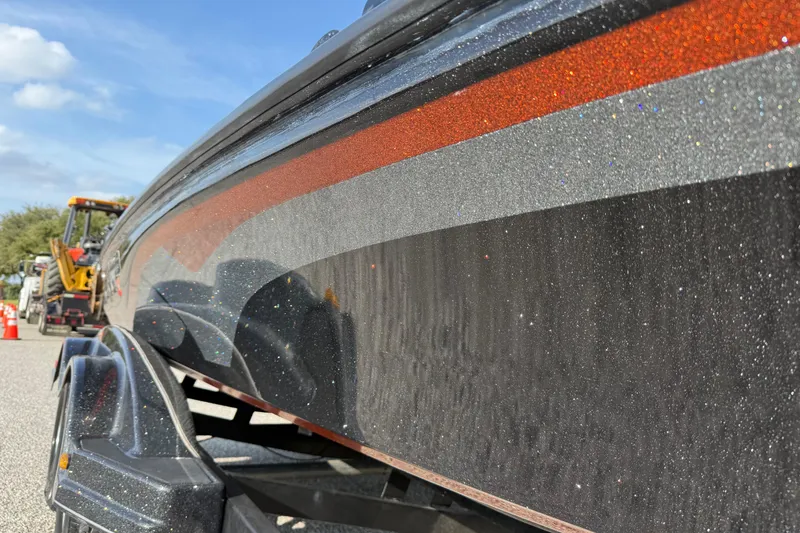 Slide: The Image of 2019 Nitro Z21 Pro boat with glittery finish on a trailer, under a clear blue sky. - 38
