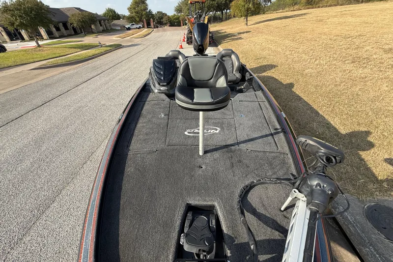 Slide: The Image of 2019 Nitro Z21 Pro boat on a residential street, featuring seating and equipment. - 40